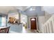Welcoming foyer with high ceilings, arched window, and a view of the kitchen at 101 Grand Junction Blvd, Orlando, FL 32835