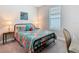 Cozy bedroom features a window and comfortable bed at 1029 Umbria Dr, Poinciana, FL 34759