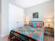 Bedroom with a window and closet doors at 1029 Umbria Dr, Poinciana, FL 34759