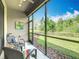 Relax on this screened lanai with views of the backyard and a tranquil outdoor space at 1029 Umbria Dr, Poinciana, FL 34759