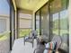 Enjoy the outdoors on this screened lanai with comfortable seating and views of the backyard at 1029 Umbria Dr, Poinciana, FL 34759