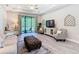 Comfortable living room with a screened-in porch visible through large sliding glass doors at 1029 Umbria Dr, Poinciana, FL 34759