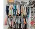Well-organized walk-in closet with ample shelving, hanging space, and storage solutions for optimal convenience at 112 Grand Canal Dr, Poinciana, FL 34759
