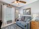 Comfortable living room with a cozy loveseat and a decorative world map at 112 Grand Canal Dr, Poinciana, FL 34759