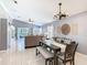 This spacious floor plan connects the living and dining areas with tile floors and neutral colors at 112 Grand Canal Dr, Poinciana, FL 34759