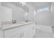 Elegant bathroom featuring a dual sink vanity, quartz counters, and a separate shower at 1251 Ash Tree Cv, Casselberry, FL 32707
