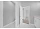 Attached bathroom view with granite counters, white cabinets, and tile floor at 1251 Ash Tree Cv, Casselberry, FL 32707