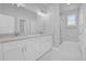 Modern bathroom boasts a dual sink vanity, quartz counters, and updated fixtures at 1251 Ash Tree Cv, Casselberry, FL 32707