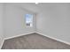 Serene bedroom with a bright window, soft carpeting, and neutral walls at 1251 Ash Tree Cv, Casselberry, FL 32707