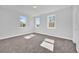 Bright bedroom features plush carpet, neutral paint, and an abundance of natural light at 1251 Ash Tree Cv, Casselberry, FL 32707