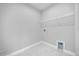Functional laundry area with white tile flooring, overhead shelving, and utility connections at 1251 Ash Tree Cv, Casselberry, FL 32707