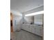 Bright bathroom with a double vanity, white cabinets, and modern fixtures for a luxurious feel at 19235 Allium Pl, Orlando, FL 32827