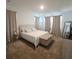 Bright and inviting primary bedroom with neutral colors, natural light, and cozy carpet at 19235 Allium Pl, Orlando, FL 32827