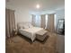 Calming primary bedroom with neutral decor, plush carpet, and ample natural light at 19235 Allium Pl, Orlando, FL 32827