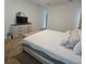 Comfortable bedroom with soft carpet, neutral walls, and a modern dresser at 19235 Allium Pl, Orlando, FL 32827