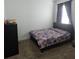 Cozy bedroom featuring a bed, bedside table, curtains, and dresser for a relaxing space at 19235 Allium Pl, Orlando, FL 32827