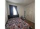 Cozy bedroom with a sports-themed bedspread and ample closet space at 19235 Allium Pl, Orlando, FL 32827
