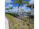 Community pool area with palm trees and lounge chairs at 19235 Allium Pl, Orlando, FL 32827