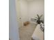 Light-filled entryway featuring a bench, shoe rack, and neutral decor at 19235 Allium Pl, Orlando, FL 32827