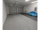 This garage is equipped with epoxy floors, providing a safe and easy-to-clean parking space at 19235 Allium Pl, Orlando, FL 32827