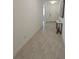 Hallway features stylish tile floors and light-colored walls at 19235 Allium Pl, Orlando, FL 32827