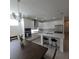 Bright kitchen featuring white cabinetry, stainless steel appliances, and island with bar seating at 19235 Allium Pl, Orlando, FL 32827