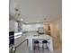 Modern kitchen with white cabinets, stainless steel appliances, and a large center island at 19235 Allium Pl, Orlando, FL 32827