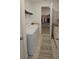 Well-equipped laundry room with modern washer and dryer, plus storage at 19235 Allium Pl, Orlando, FL 32827