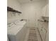 Well-lit laundry room with plenty of storage and counter space at 19235 Allium Pl, Orlando, FL 32827