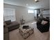 Open concept living room with modern decor and lots of natural light at 19235 Allium Pl, Orlando, FL 32827