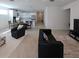 Bright and spacious living room flowing into the modern kitchen and dining area at 19235 Allium Pl, Orlando, FL 32827