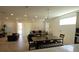 Open-concept living space with dining area, living room, and a modern kitchen at 19235 Allium Pl, Orlando, FL 32827