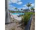 Community pool surrounded by lush greenery and lounge chairs, perfect for relaxation at 19235 Allium Pl, Orlando, FL 32827