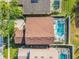 Aerial view showcasing home with screened pool, backyard, and proximity to neighborhood amenities at 207 Bailey Cir, Davenport, FL 33897