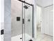 Walk-in shower with glass door, mosaic tile accent, and modern fixtures at 207 Bailey Cir, Davenport, FL 33897