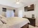 Bedroom with neutral decor, flat screen television, and natural light at 207 Bailey Cir, Davenport, FL 33897