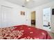 Comfortable bedroom featuring a ceiling fan, closet, and connected room at 207 Bailey Cir, Davenport, FL 33897