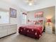 Cozy bedroom features a ceiling fan, neutral walls, and complementary decor at 207 Bailey Cir, Davenport, FL 33897