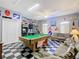 Spacious game room with a billiard table, vintage decor, and comfortable seating at 207 Bailey Cir, Davenport, FL 33897
