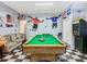 Bright and inviting game room with a pool table, offering a fun and relaxing space at 207 Bailey Cir, Davenport, FL 33897