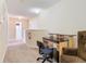 Hallway featuring neutral walls, carpet and desk at 207 Bailey Cir, Davenport, FL 33897