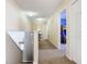 Hallway with carpet flooring that leads to a bedroom with a bunk bed in it at 207 Bailey Cir, Davenport, FL 33897