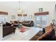 Spacious living room with tile flooring, ceiling fan, and lots of natural light at 207 Bailey Cir, Davenport, FL 33897