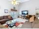 Bright living room featuring tile floors, recessed lighting, and comfortable couches at 207 Bailey Cir, Davenport, FL 33897