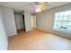Bedroom featuring light colored walls, laminate floors, and a ceiling fan at 2213 Metropolitan Way # 1318, Orlando, FL 32839