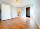 Bright bedroom with laminate floors, ceiling fan, and ensuite bathroom at 2213 Metropolitan Way # 1318, Orlando, FL 32839