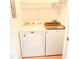Convenient laundry area features a white Maytag dryer and Whirlpool washer at 2213 Metropolitan Way # 1318, Orlando, FL 32839