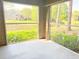 Screened in porch overlooking pond and lush greenery providing a serene outdoor space at 2213 Metropolitan Way # 213, Orlando, FL 32839