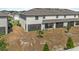 An exterior view showcasing the backyard, screened patio, and the structure of the townhome at 2302 Tay Wes Dr, St Cloud, FL 34771