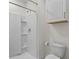 This bathroom offers a streamlined shower and a floating cabinet for space-saving convenience at 2302 Tay Wes Dr, St Cloud, FL 34771